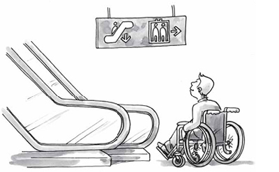 une personne en fauteuil roulant au pied de l'escalator